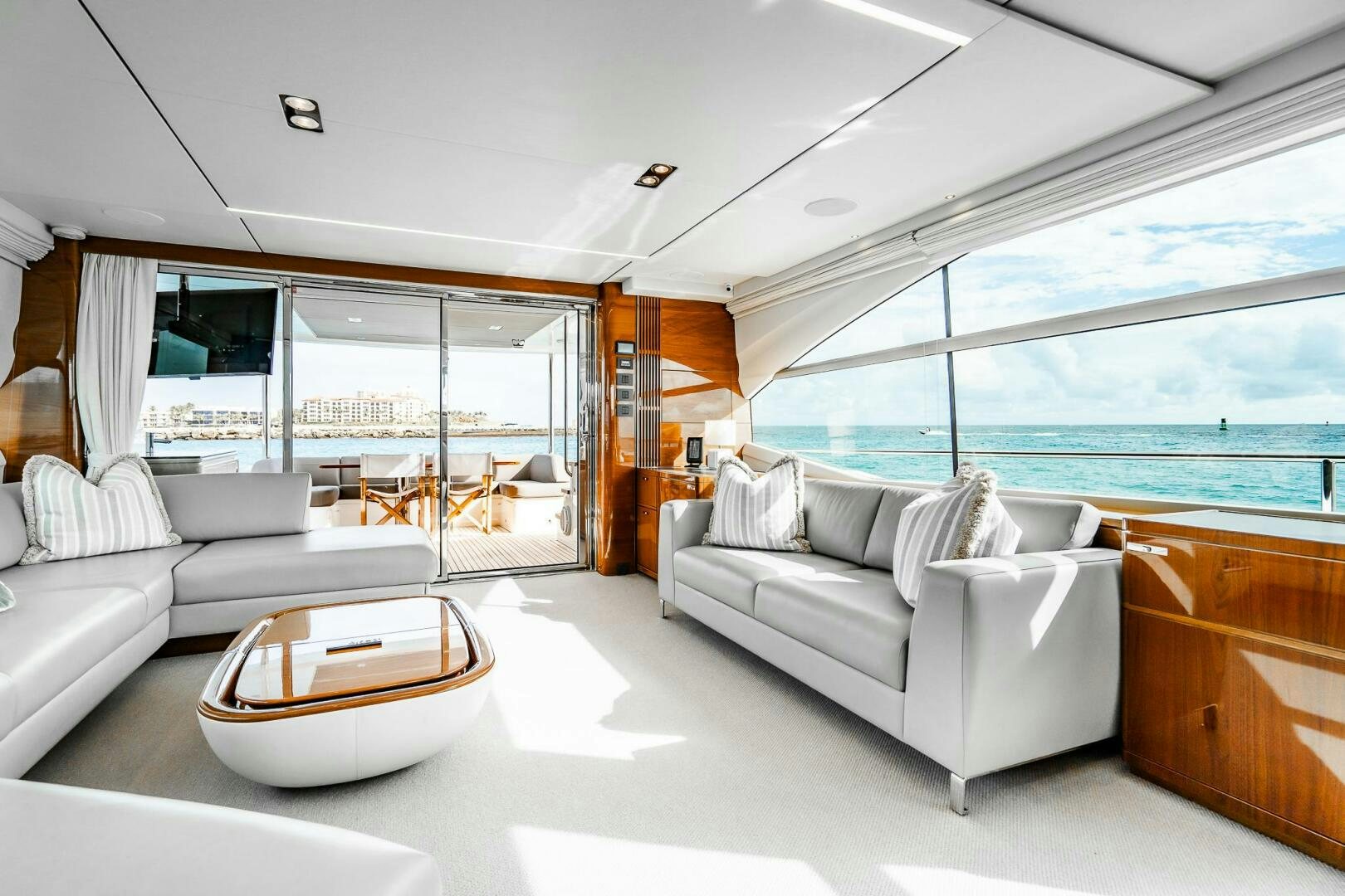 a living room with a large window aboard PERFECT MATCH Yacht for Sale