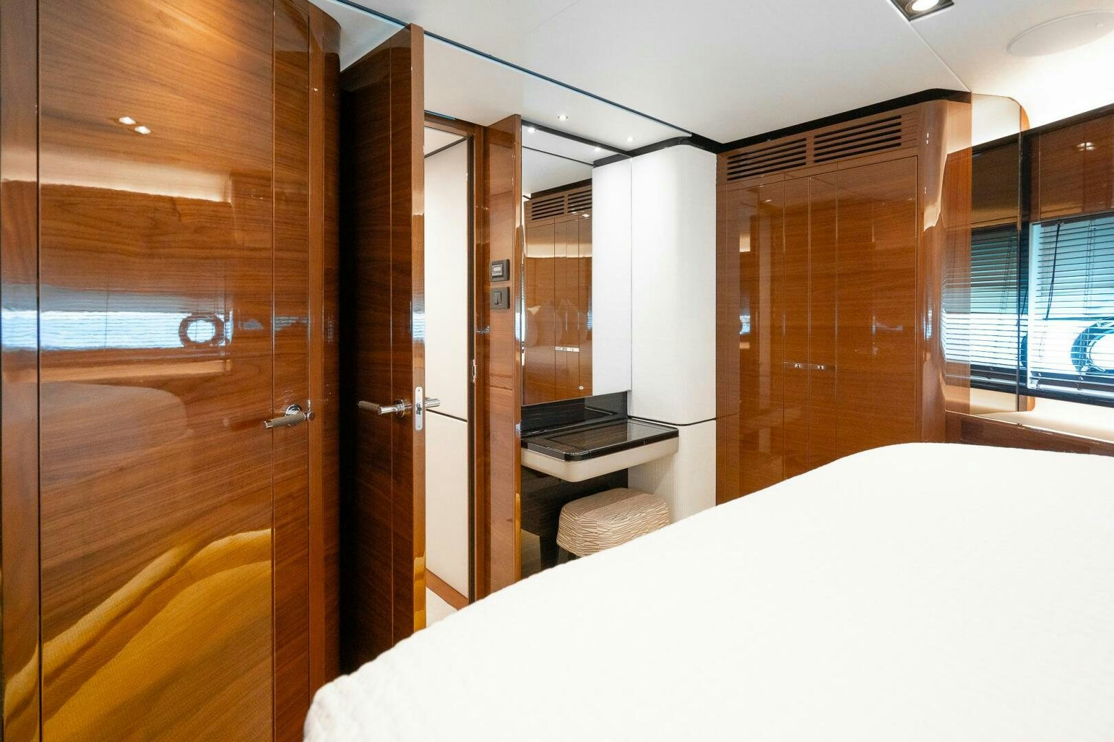 a room with a bed and desk aboard PERFECT MATCH Yacht for Sale