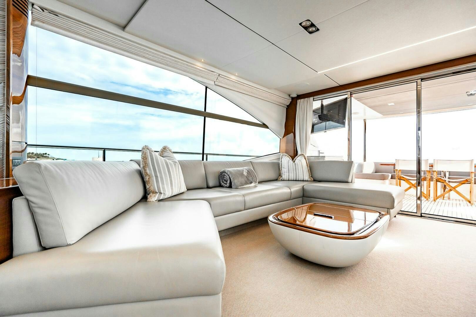 a living room with a large window aboard PERFECT MATCH Yacht for Sale