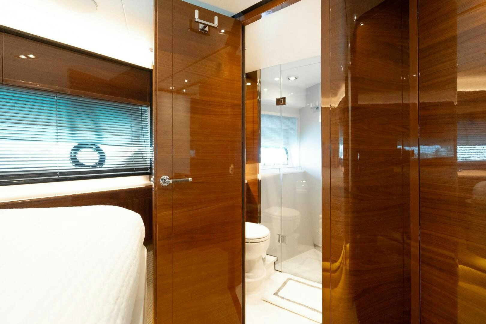 a bathroom with glass doors aboard PERFECT MATCH Yacht for Sale