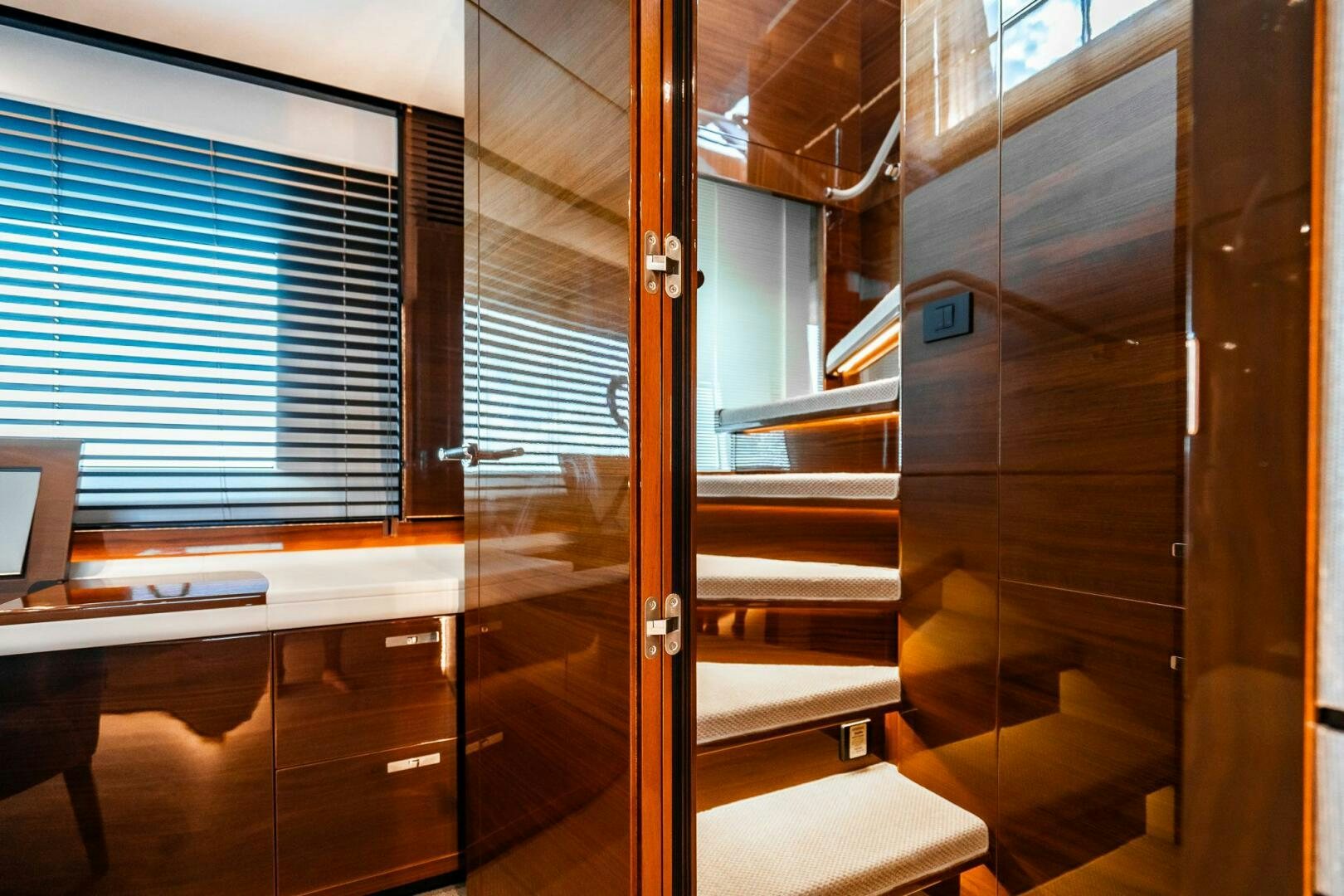 a room with a glass door aboard PERFECT MATCH Yacht for Sale