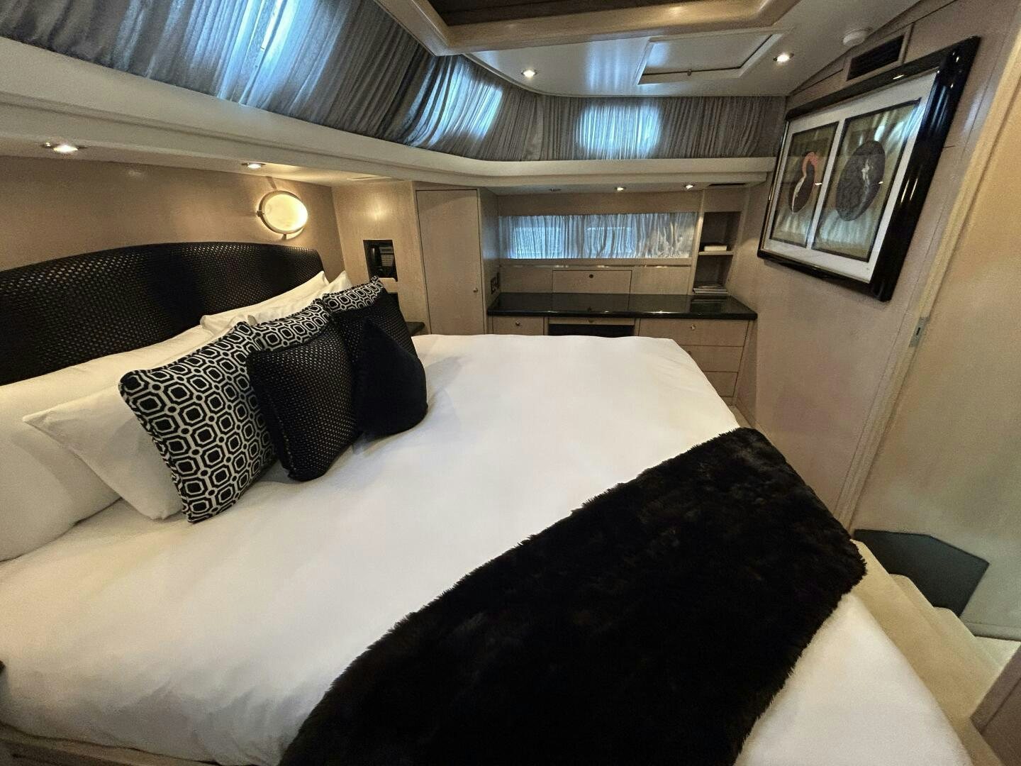 a bed with pillows aboard TOTO Yacht for Sale