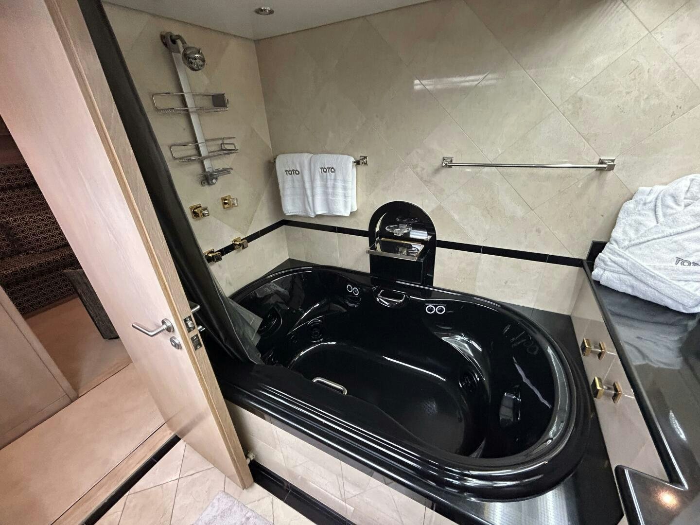 a black sink in a bathroom aboard TOTO Yacht for Sale