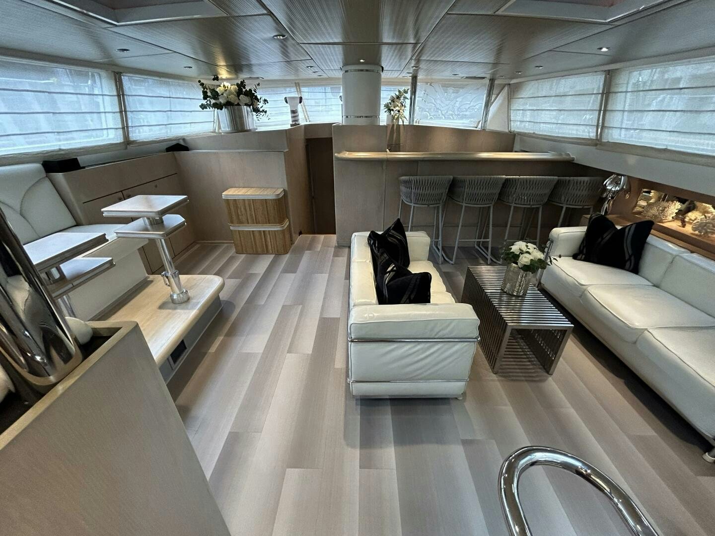 a room with a couch and a table aboard TOTO Yacht for Sale