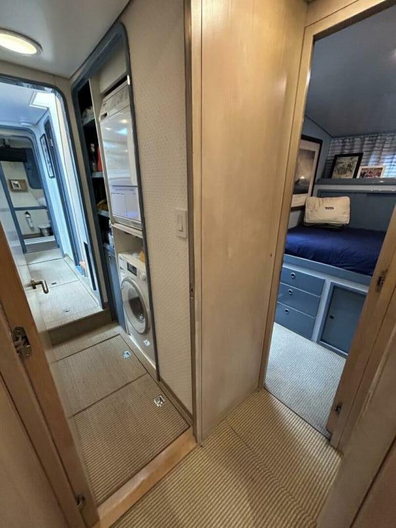 a room with a door and a mirror aboard TOTO Yacht for Sale