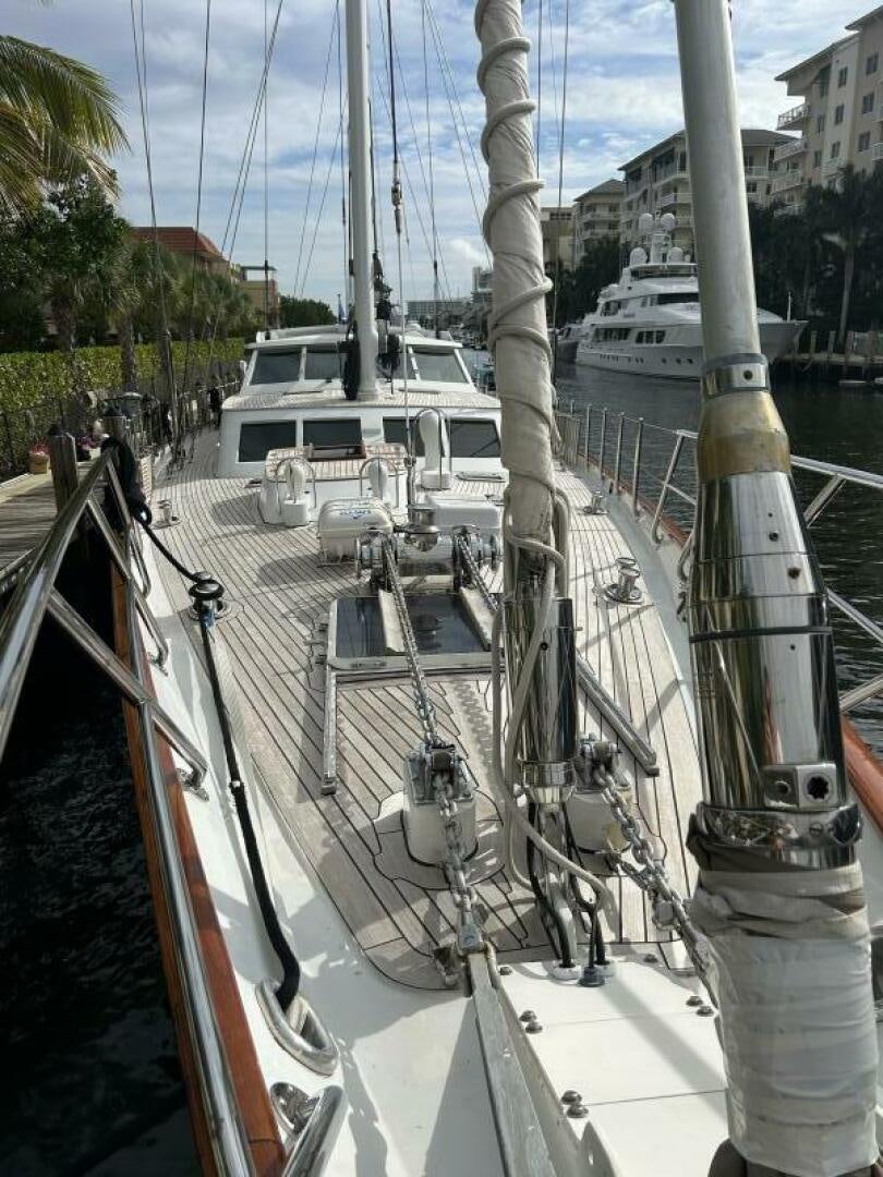 a group of white boats on a dock aboard TOTO Yacht for Sale