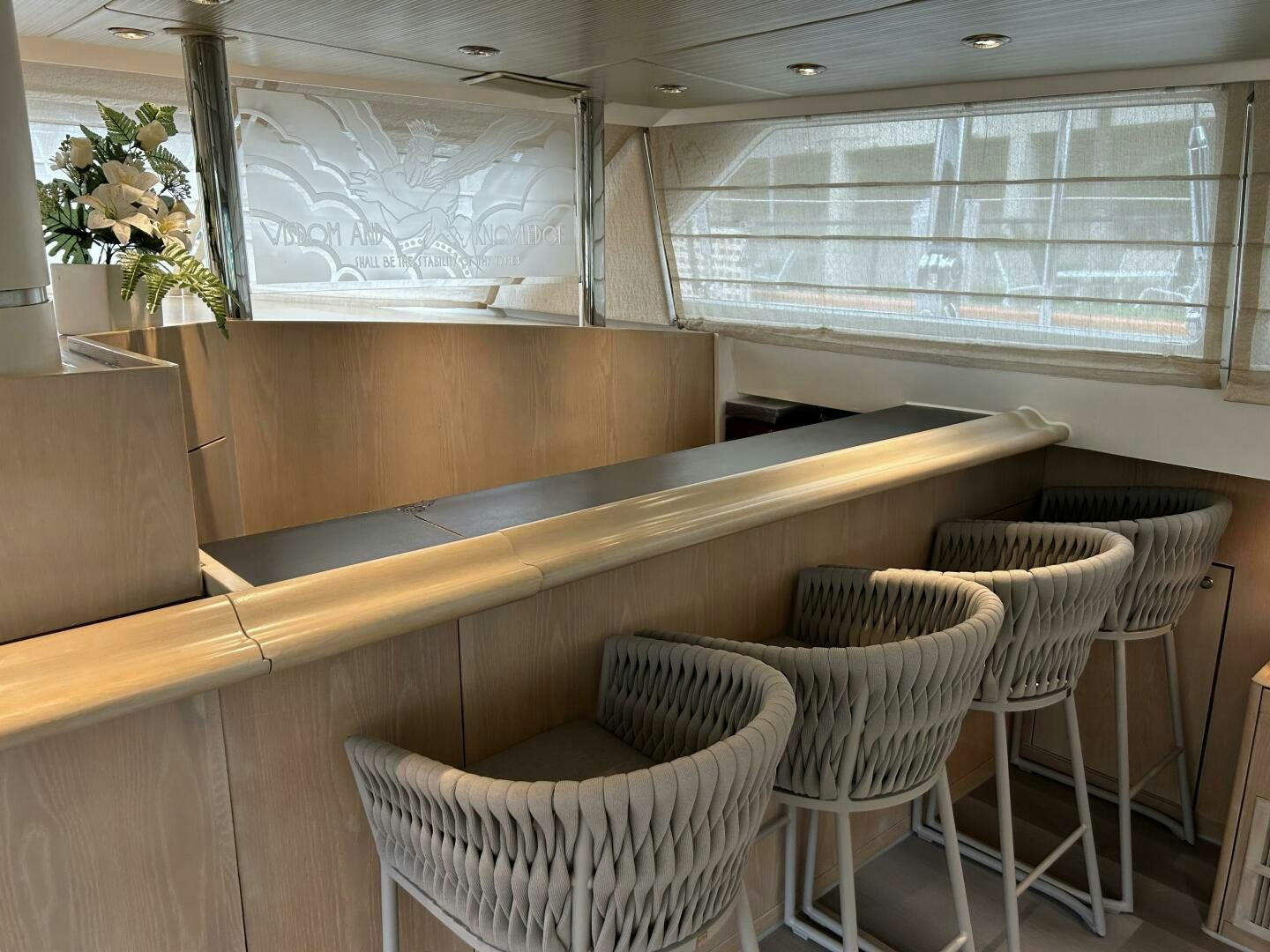 a room with chairs and a piano aboard TOTO Yacht for Sale