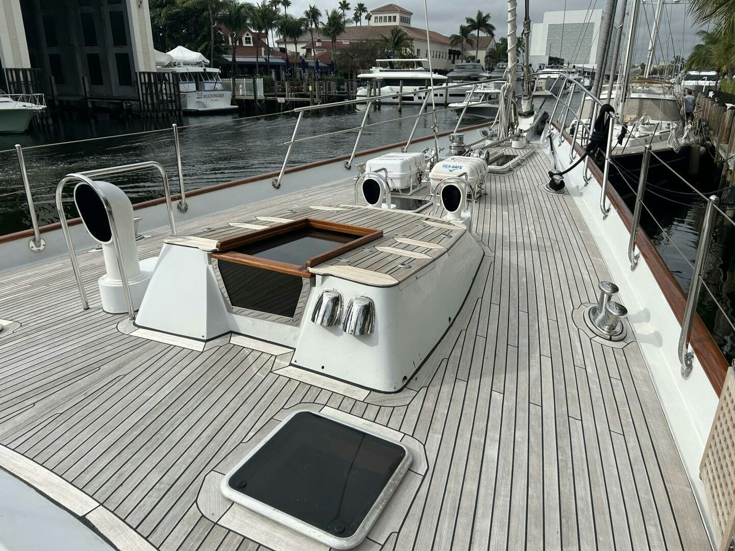 a white boat on a deck aboard TOTO Yacht for Sale