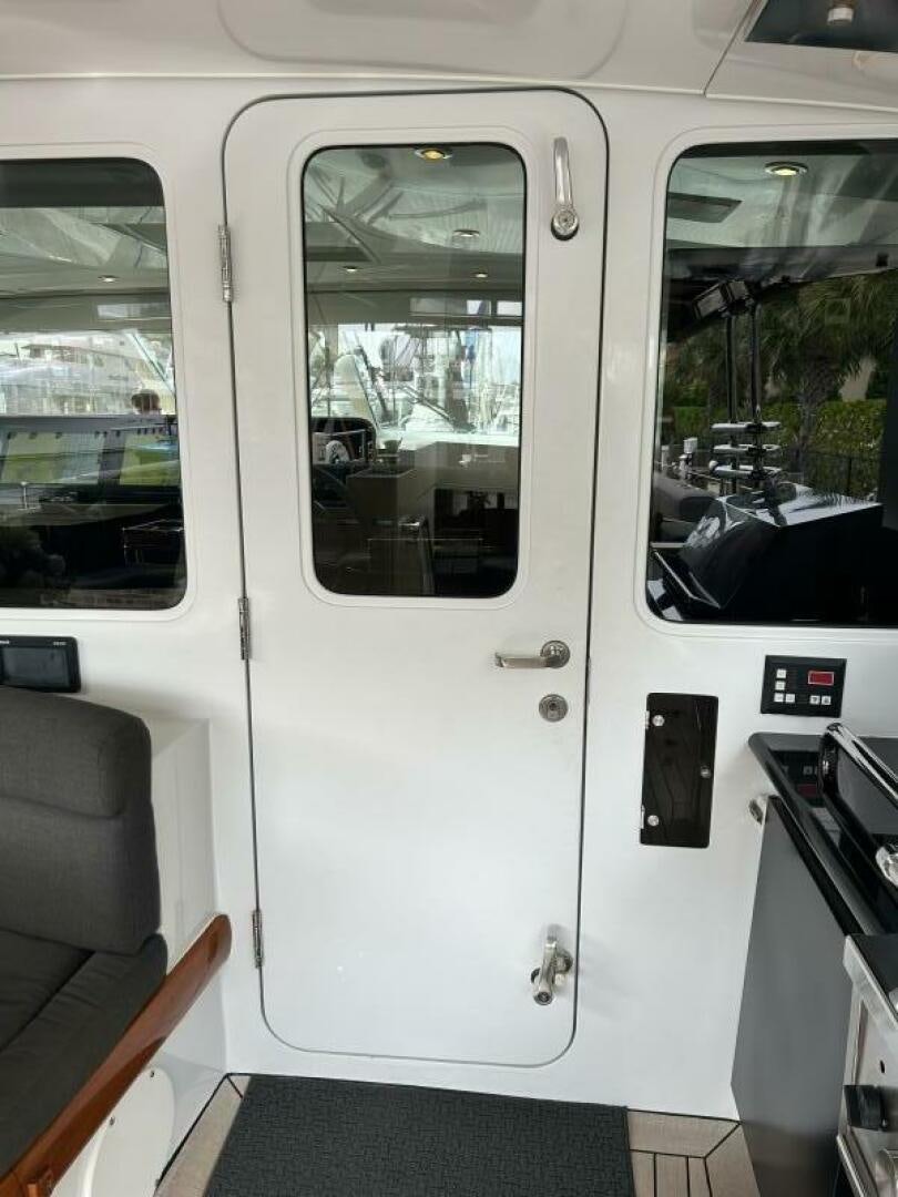 a white bus with a door open aboard TOTO Yacht for Sale
