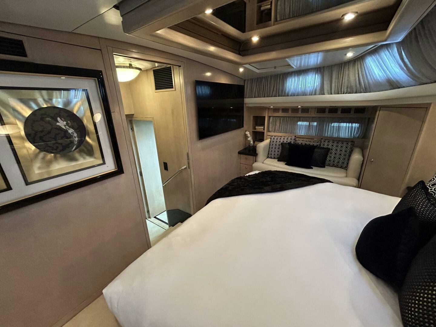 a room with a bed and a couch aboard TOTO Yacht for Sale