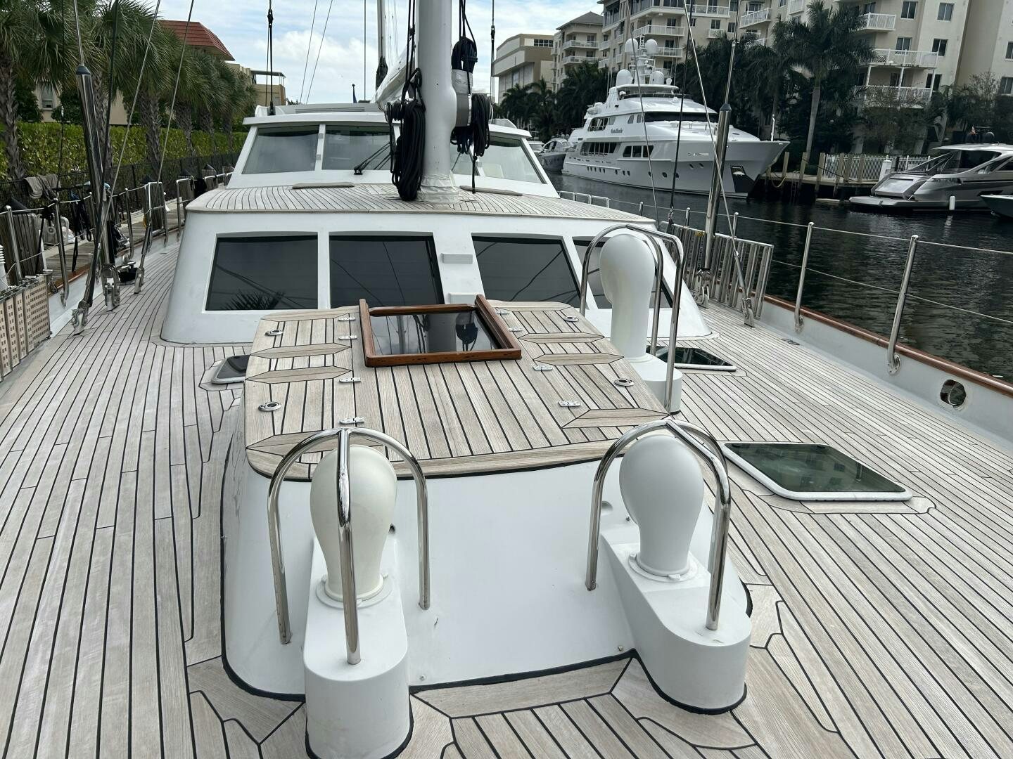 a white table with chairs on it aboard TOTO Yacht for Sale