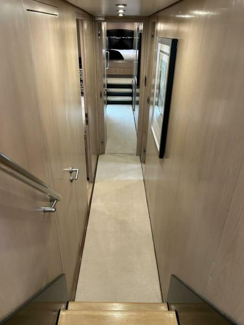 a hallway with a door aboard TOTO Yacht for Sale