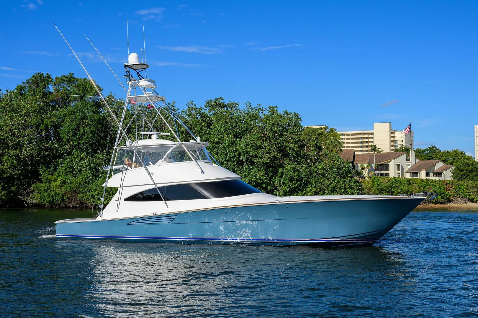 a white boat on water aboard TAMI ANN Yacht for Sale