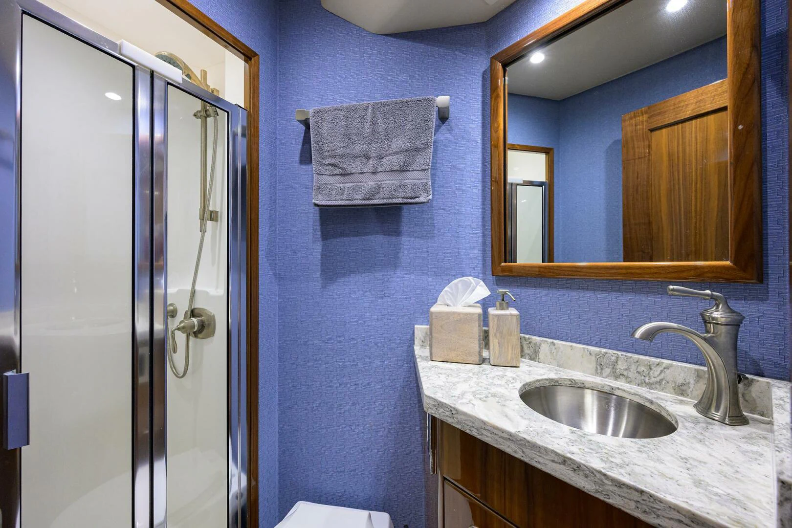a bathroom with a sink and a mirror aboard TAMI ANN Yacht for Sale