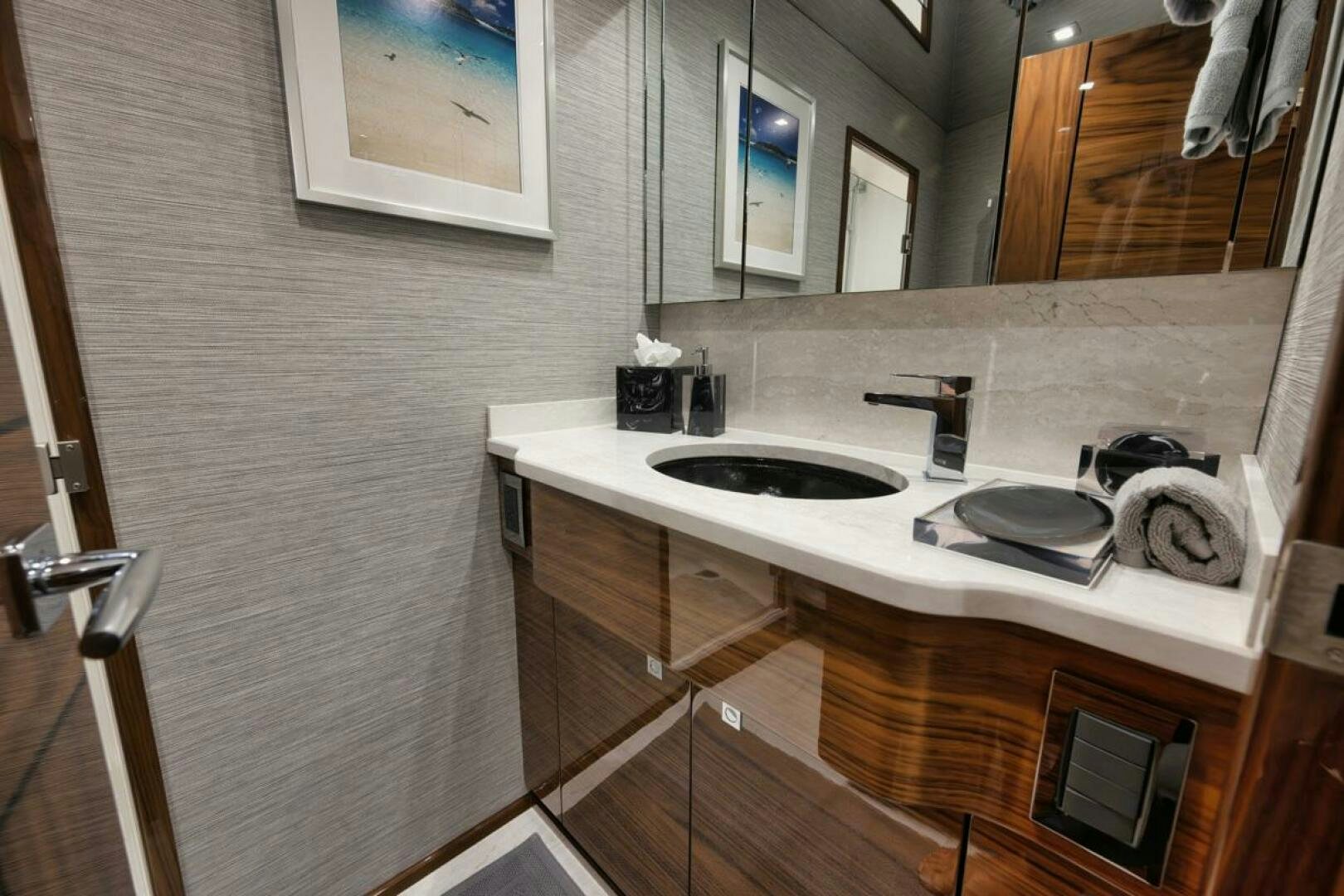 a bathroom with a sink and a mirror aboard LUCKY DICK Yacht for Sale