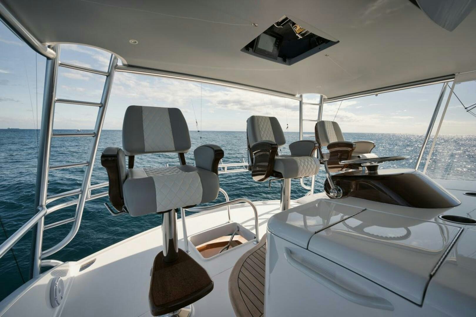 a boat with chairs and a table aboard LUCKY DICK Yacht for Sale