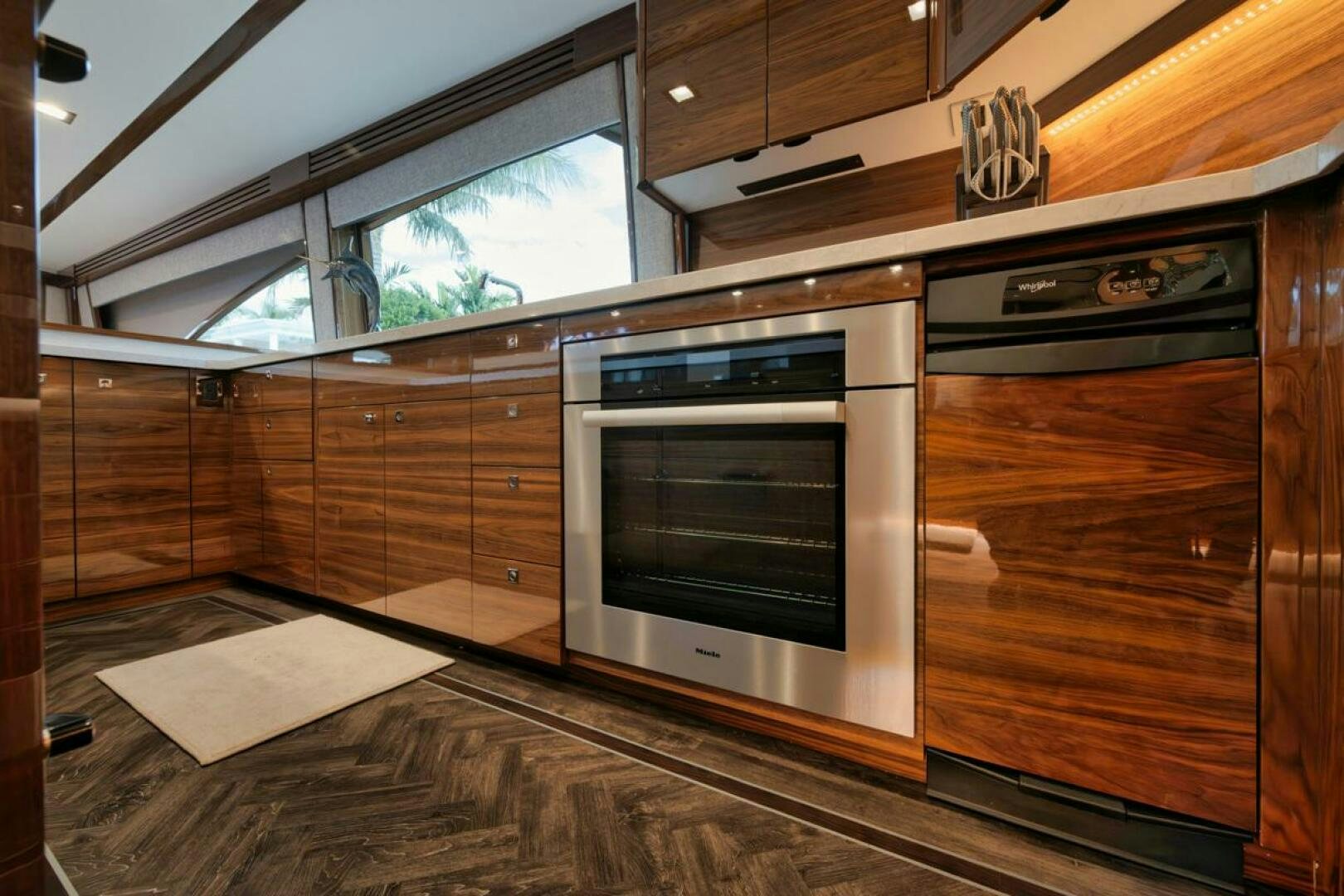 a kitchen with wooden cabinets aboard LUCKY DICK Yacht for Sale