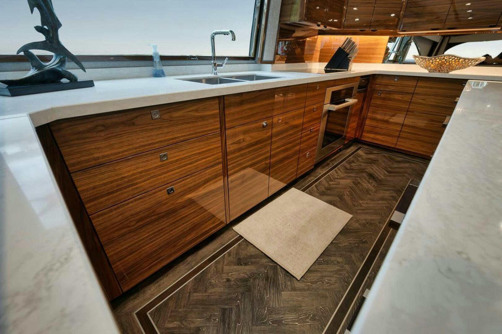 a kitchen with wooden cabinets aboard LUCKY DICK Yacht for Sale