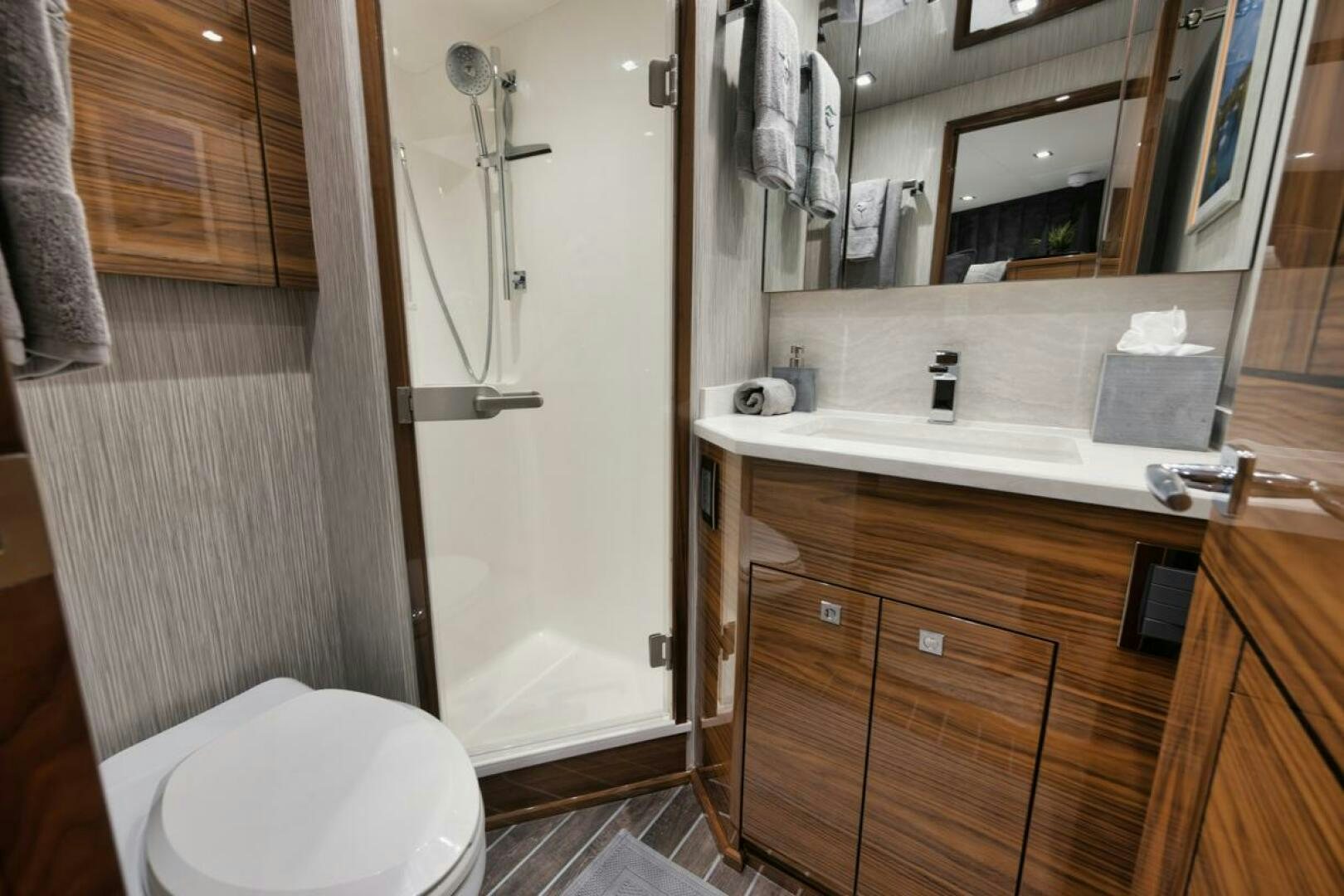 a bathroom with a sink and a toilet aboard LUCKY DICK Yacht for Sale