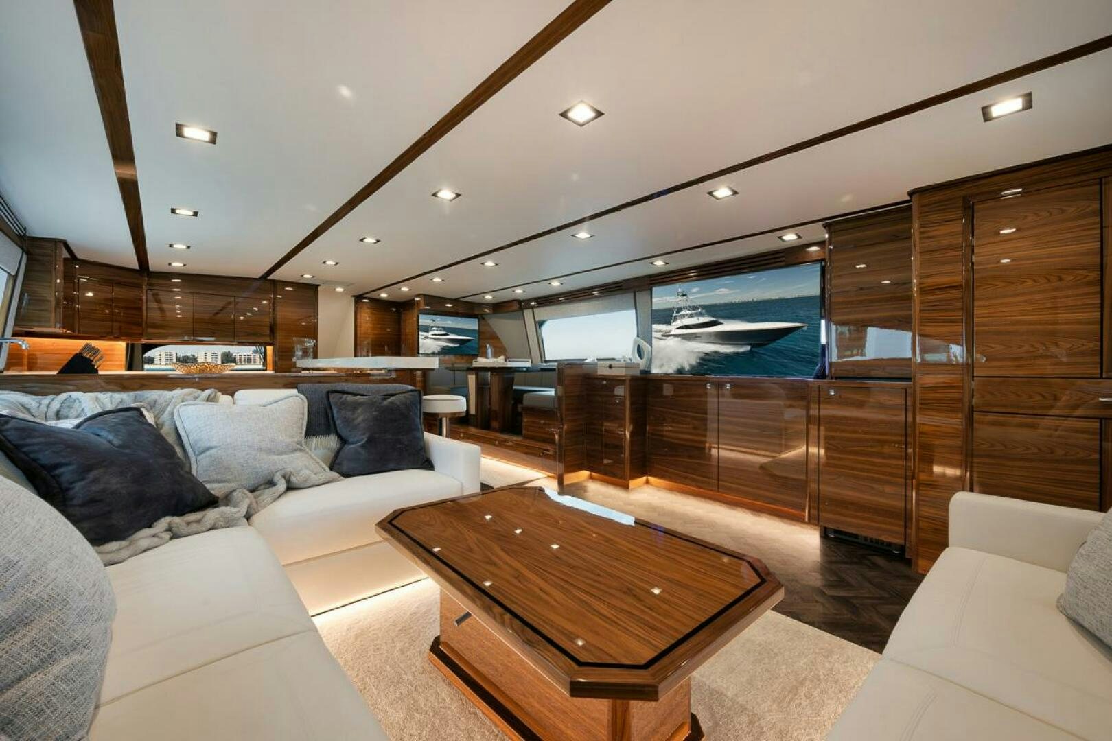 a living room with a wood coffee table and a wood coffee table aboard LUCKY DICK Yacht for Sale