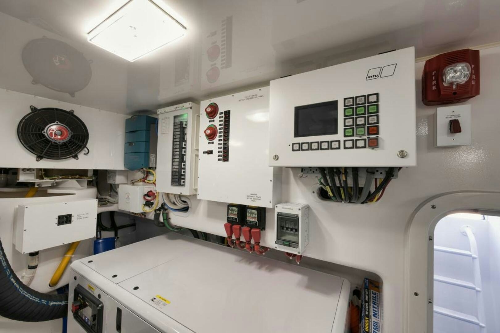 a white room with several machines aboard LUCKY DICK Yacht for Sale