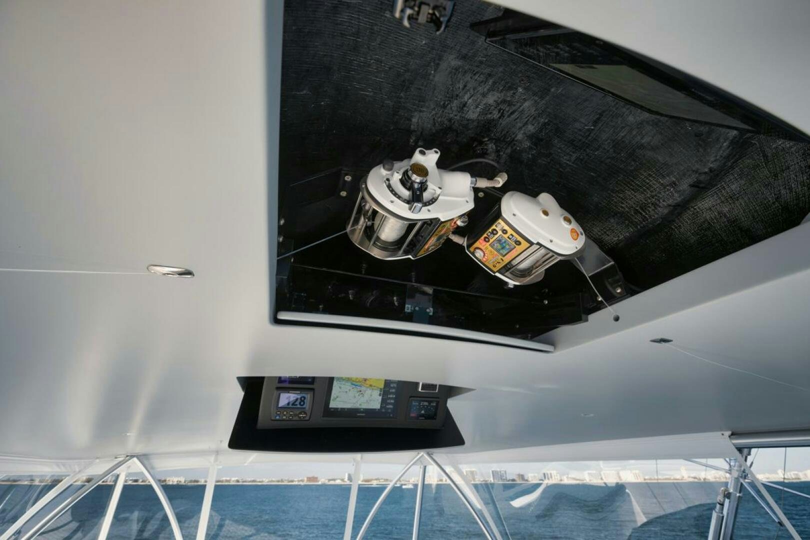 a black car on a white surface aboard LUCKY DICK Yacht for Sale