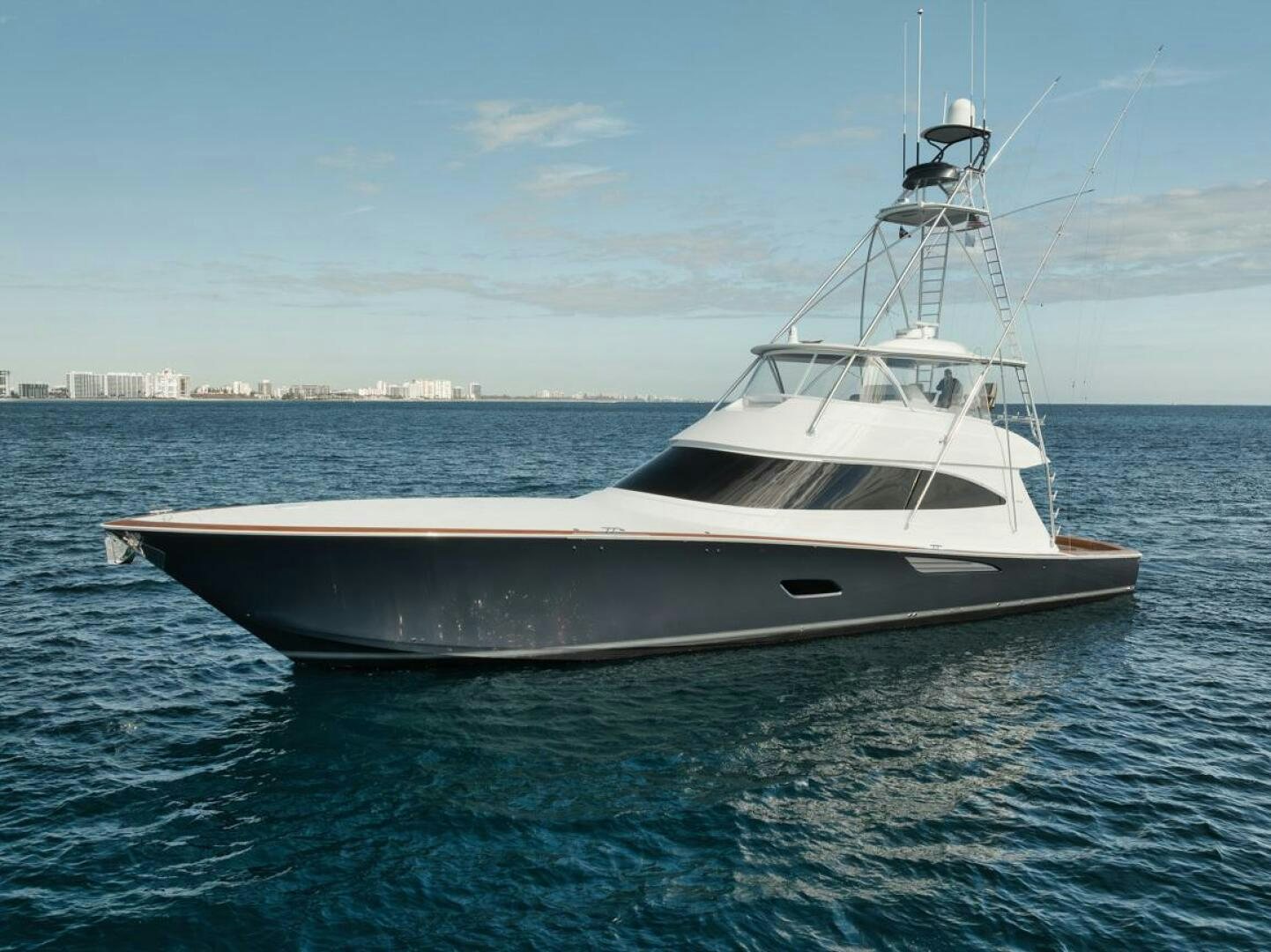 a white yacht in the water aboard LUCKY DICK Yacht for Sale