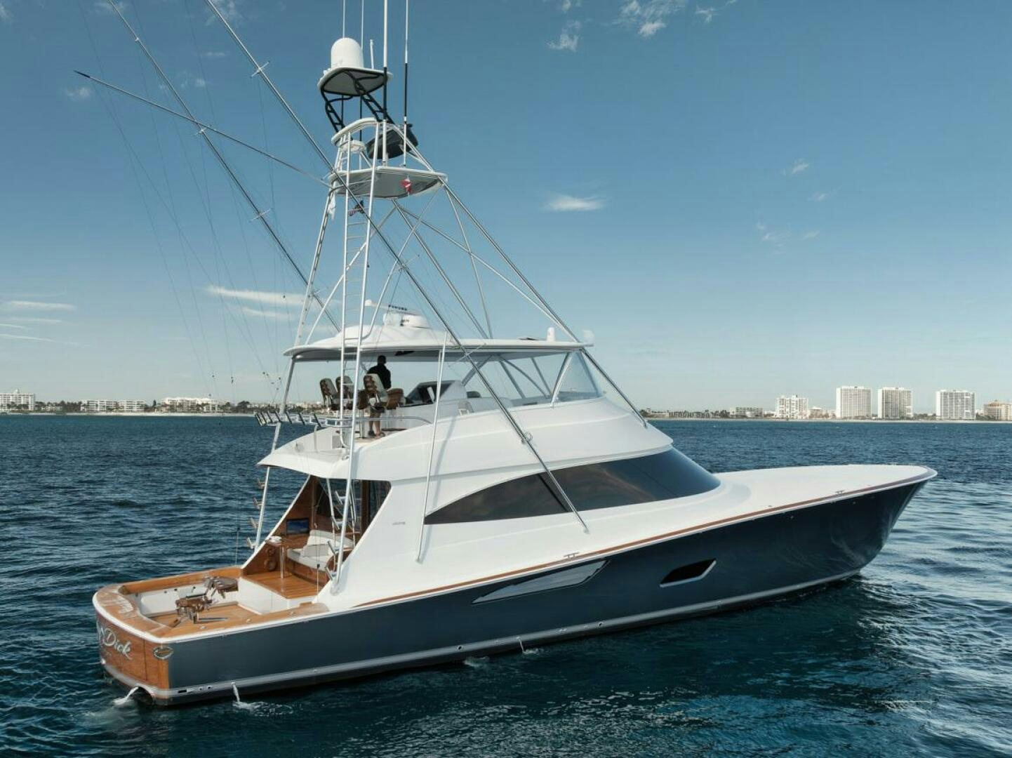 a white boat on the water aboard LUCKY DICK Yacht for Sale