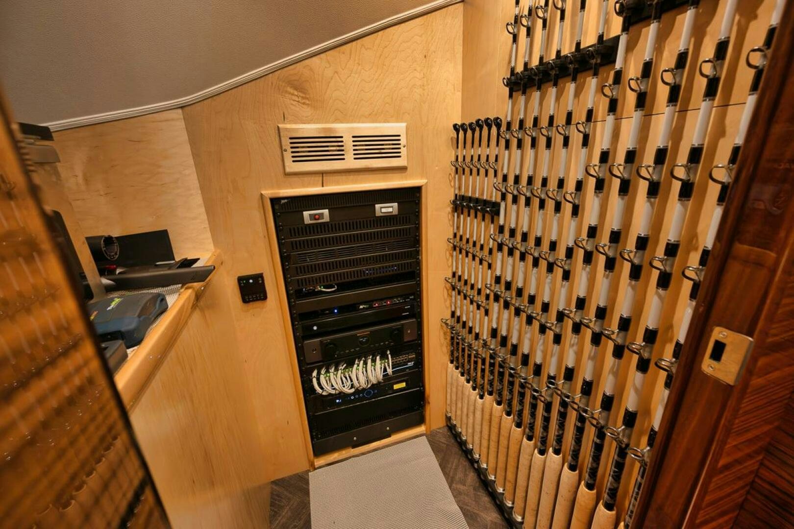 a room with a black stove and a black shelf with a vent aboard LUCKY DICK Yacht for Sale