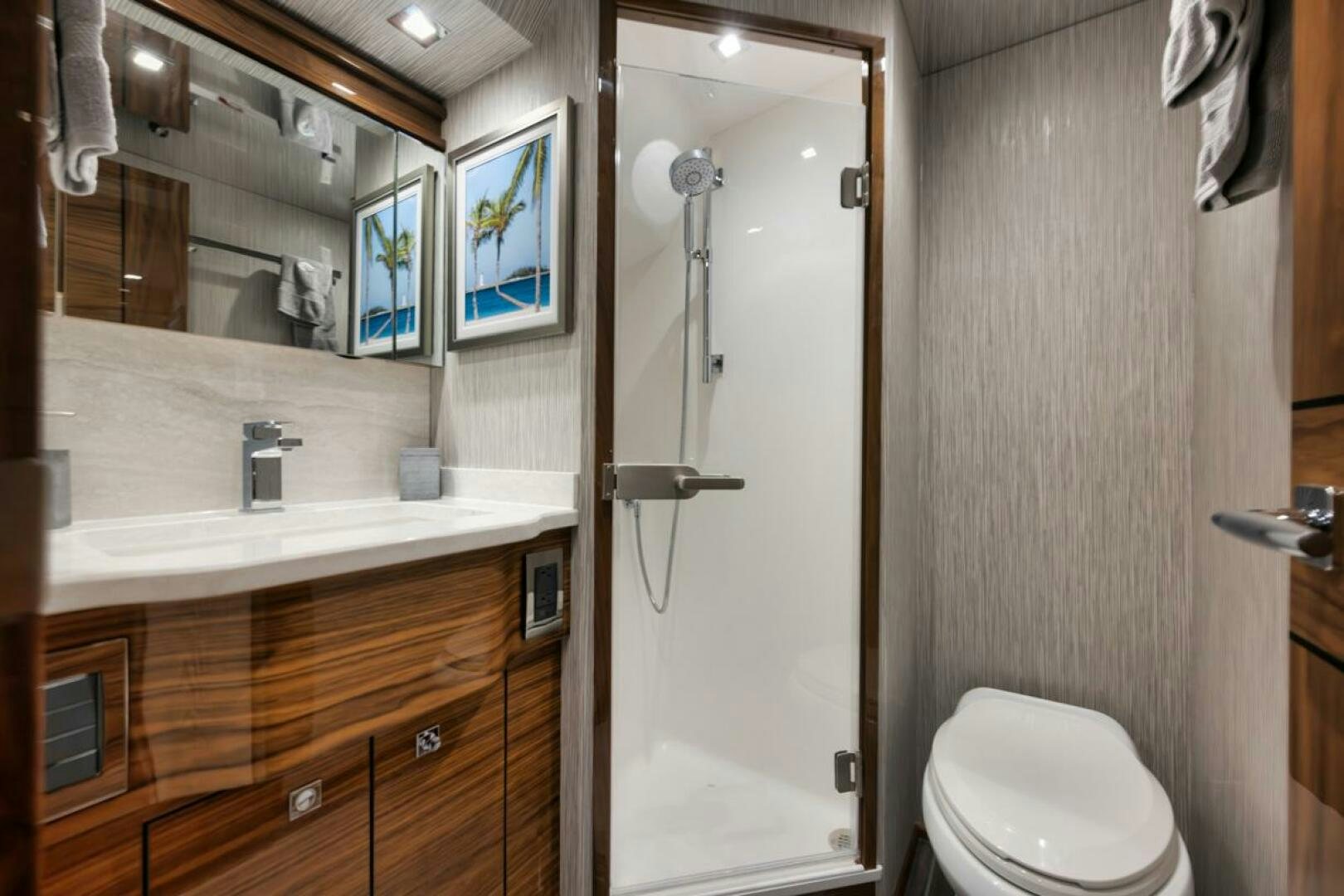 a bathroom with a toilet and a sink aboard LUCKY DICK Yacht for Sale