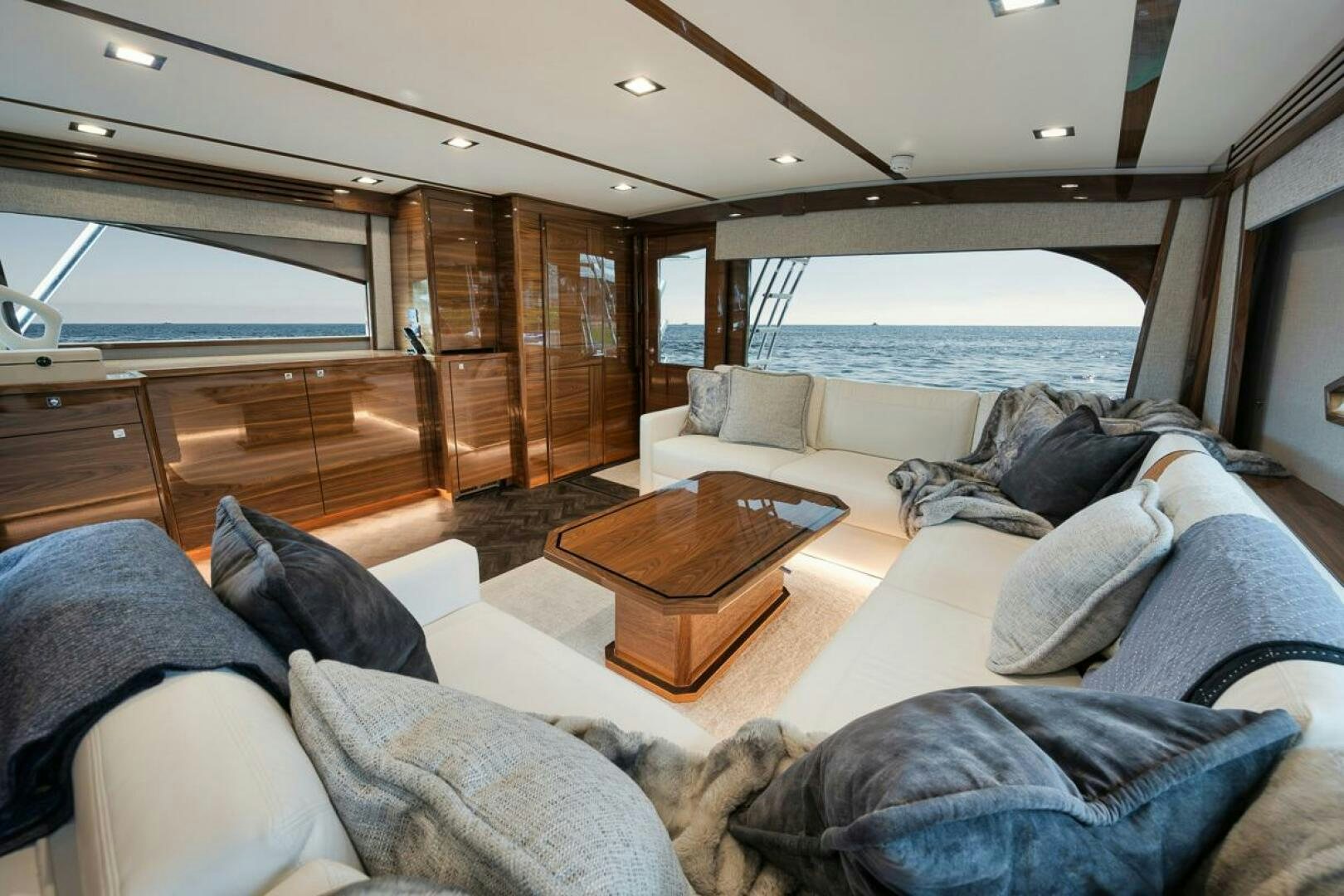 a living room with a large glass window aboard LUCKY DICK Yacht for Sale