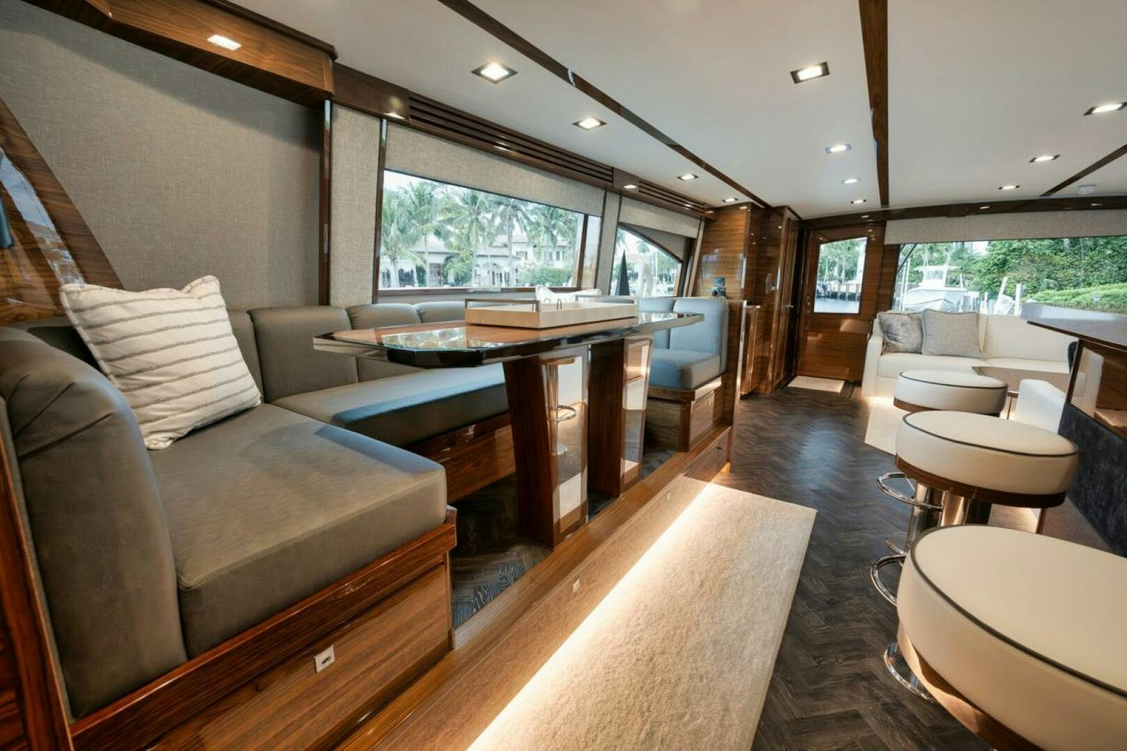 a large living room with a large table and chairs aboard LUCKY DICK Yacht for Sale