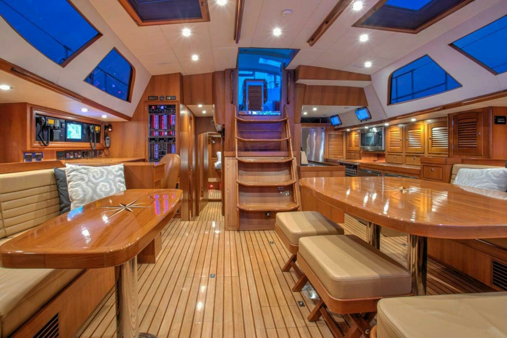 a room with a wood floor and a wood staircase aboard INDEPEPDENCE Yacht for Sale