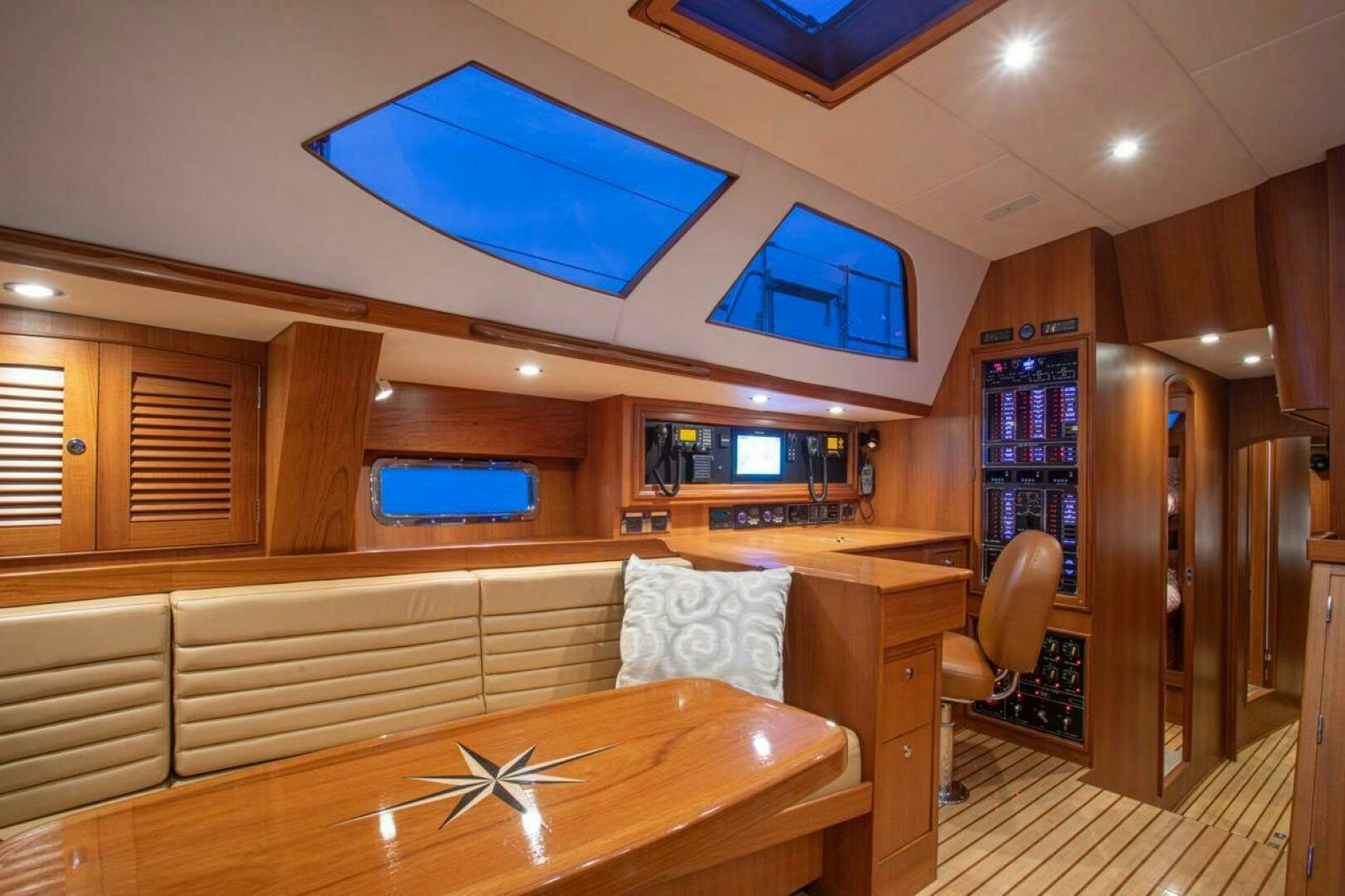 a room with a bed and a desk aboard INDEPEPDENCE Yacht for Sale