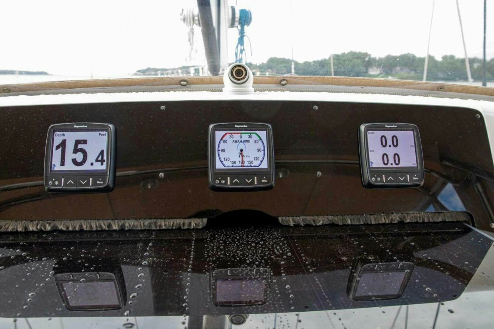 a car dashboard with a digital clock aboard INDEPEPDENCE Yacht for Sale