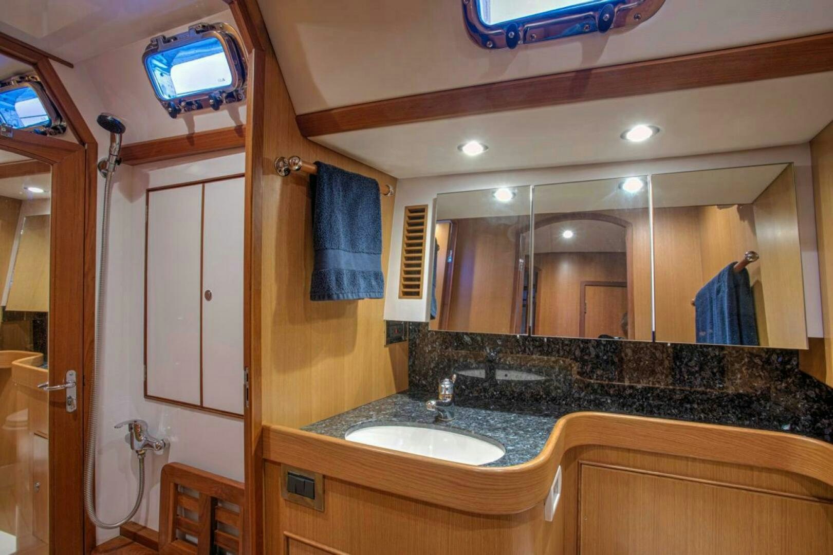 a bathroom with a large mirror aboard INDEPEPDENCE Yacht for Sale