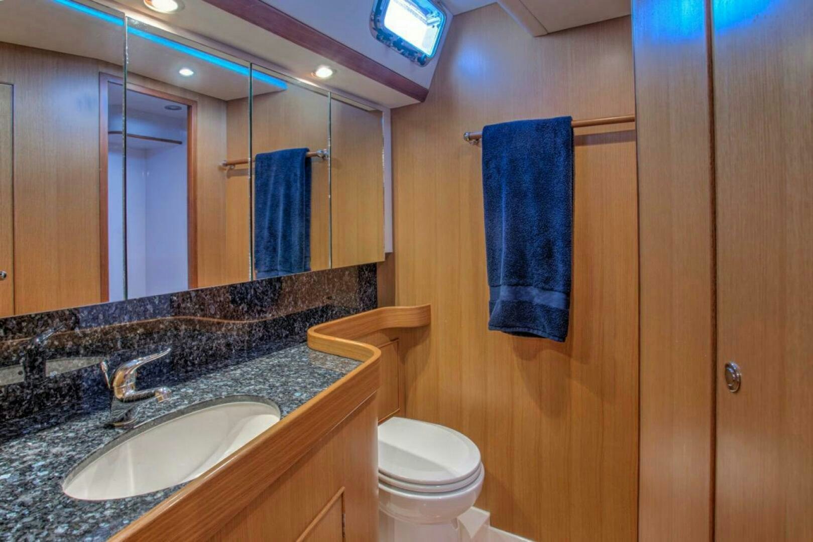 a bathroom with a sink and toilet aboard INDEPEPDENCE Yacht for Sale