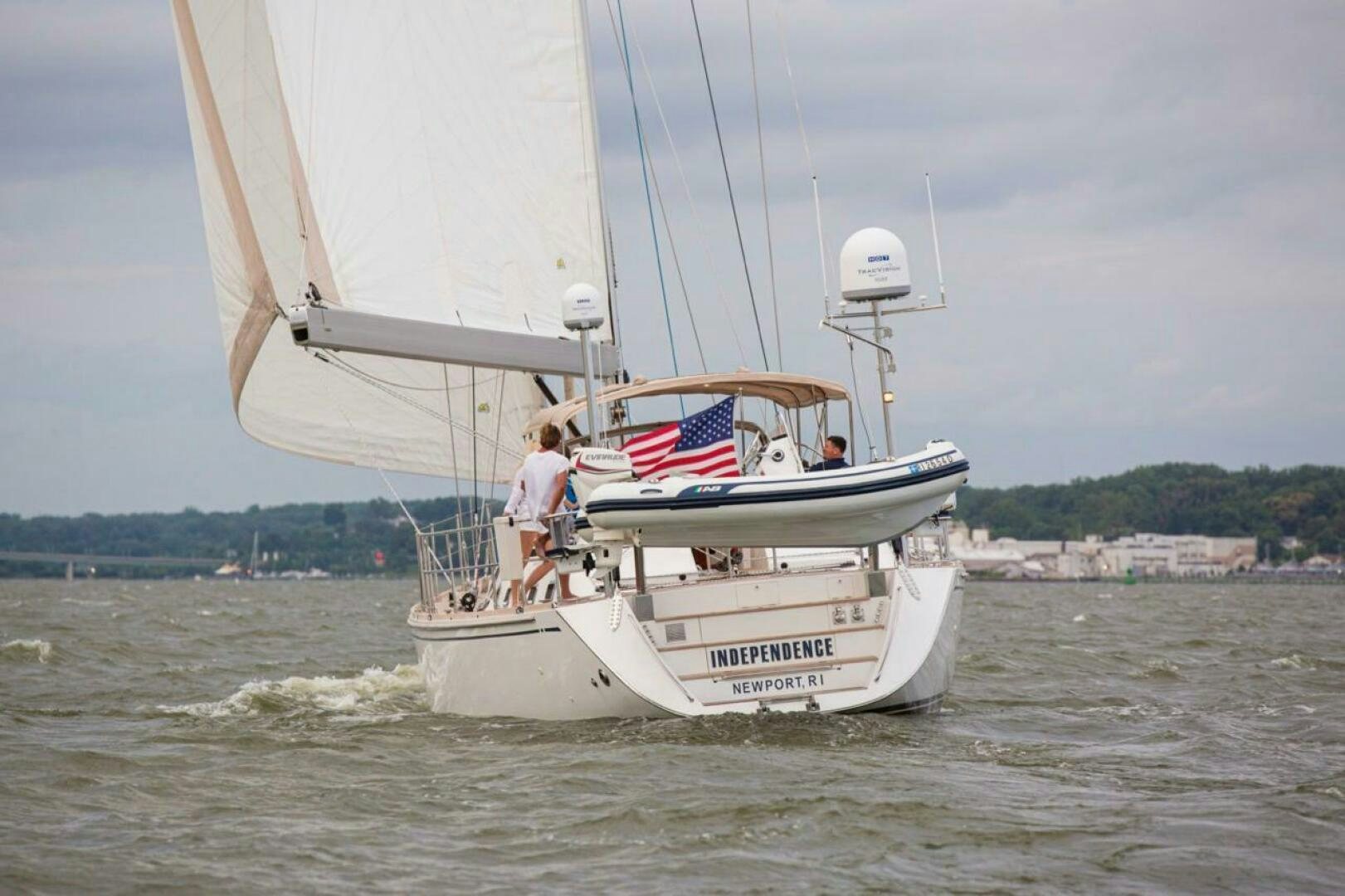 a couple people on a sailboat aboard INDEPEPDENCE Yacht for Sale