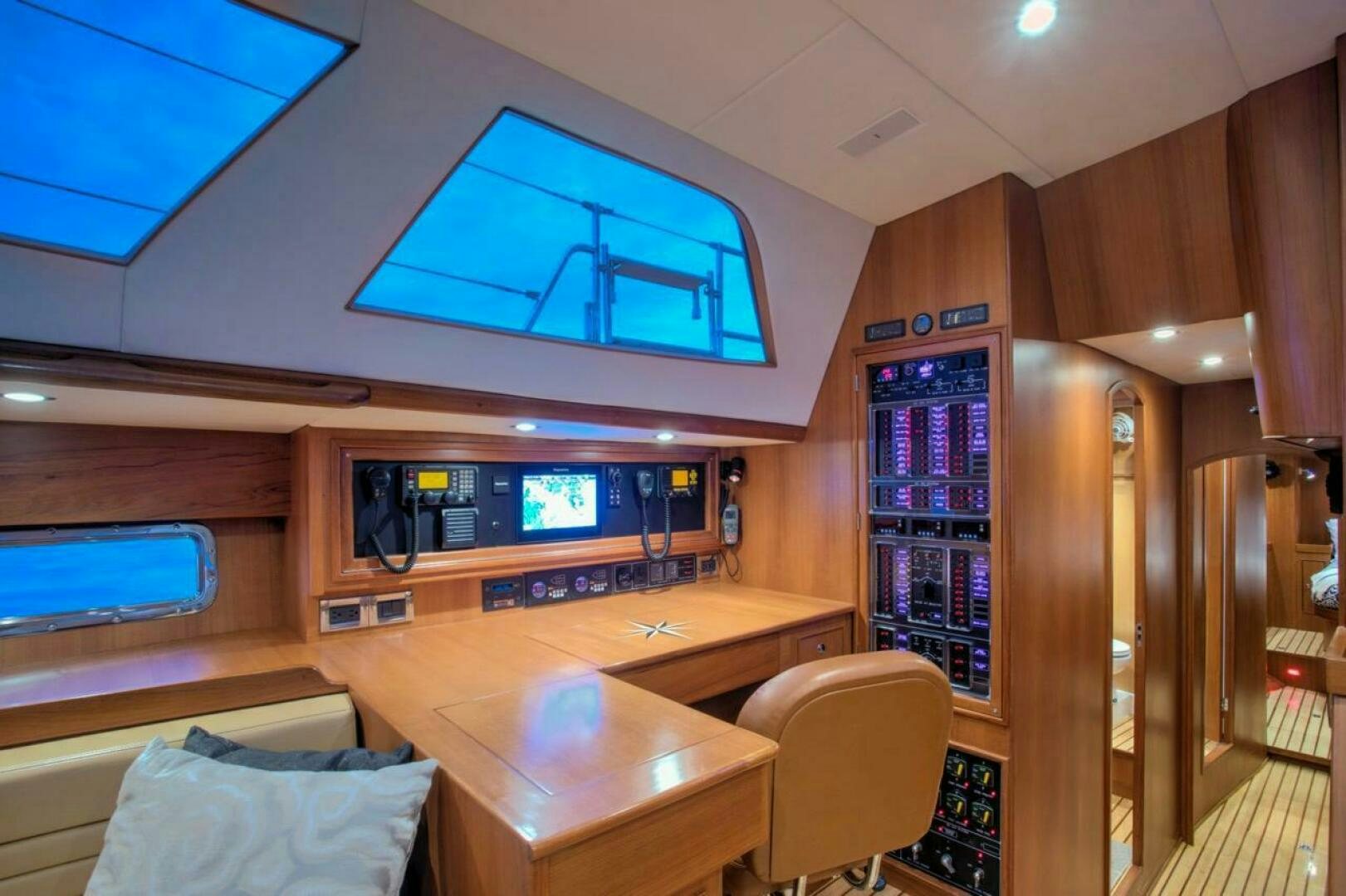a room with a desk and a tv aboard INDEPEPDENCE Yacht for Sale