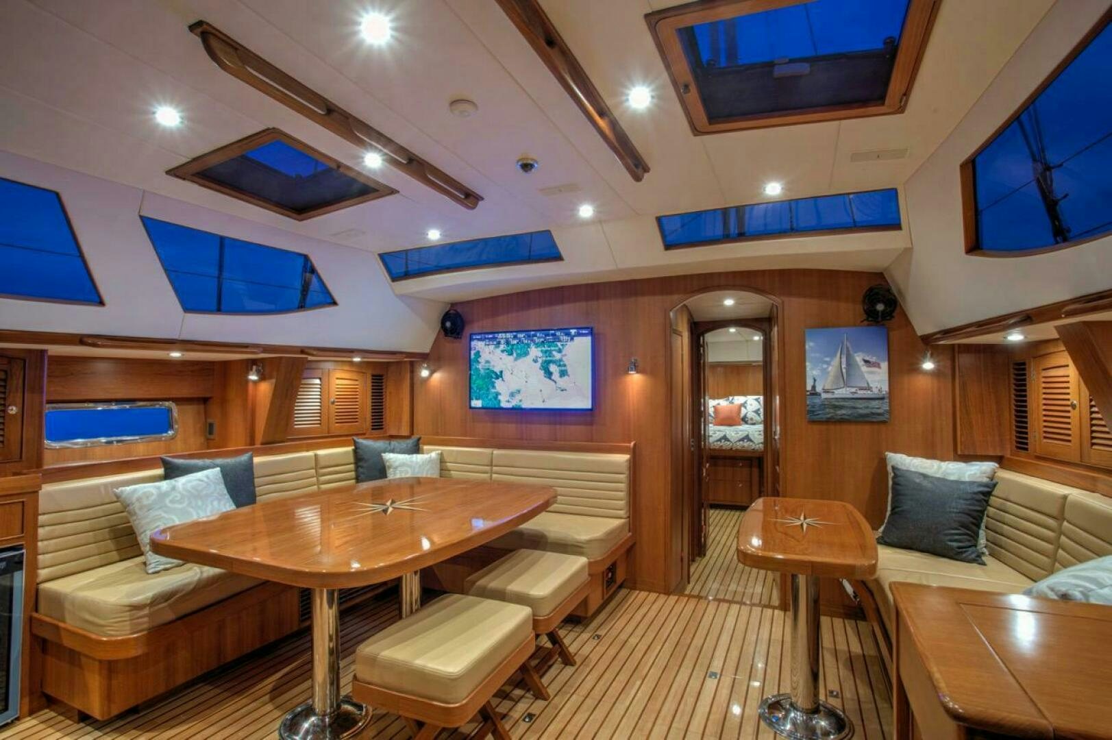a room with a table and chairs aboard INDEPEPDENCE Yacht for Sale