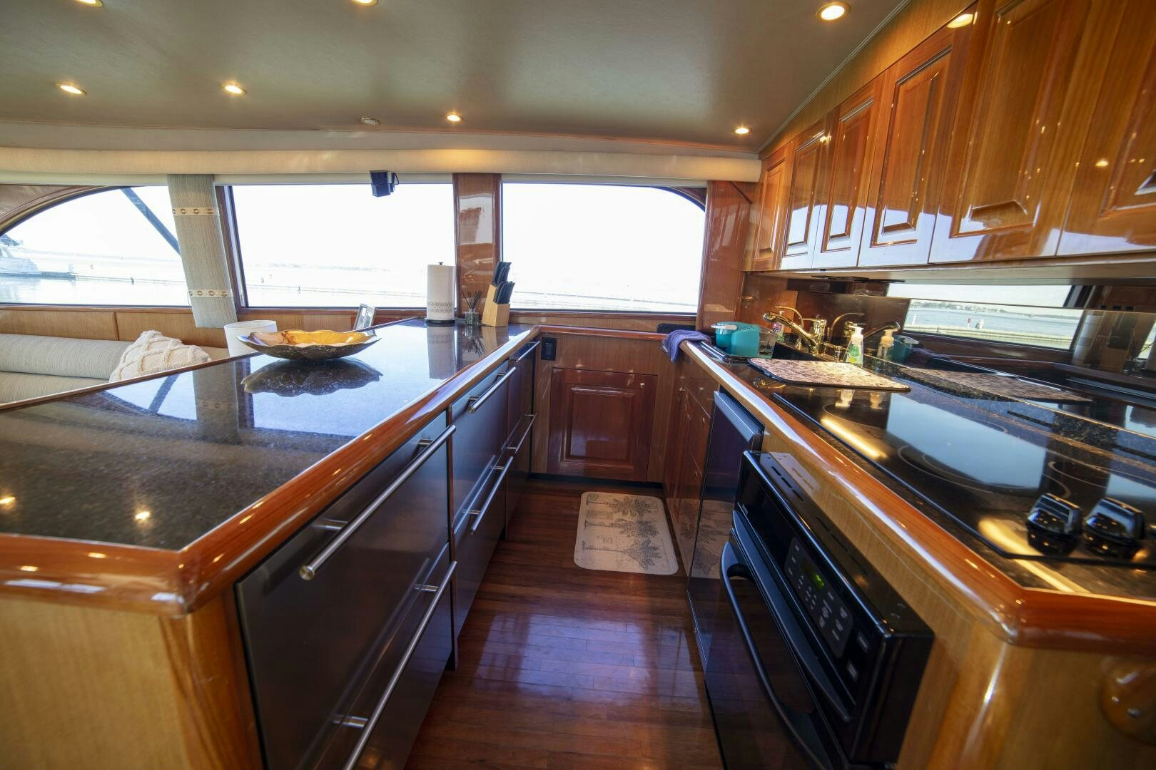 a kitchen with wooden cabinets aboard PRIME TIME Yacht for Sale