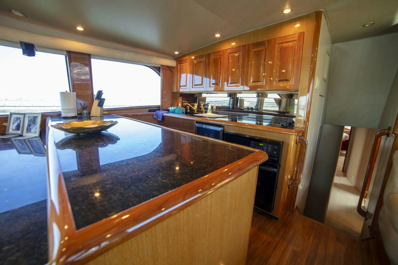 a kitchen with a large island aboard PRIME TIME Yacht for Sale