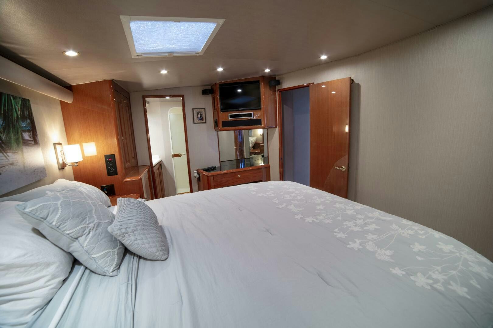 a bed with white sheets aboard PRIME TIME Yacht for Sale