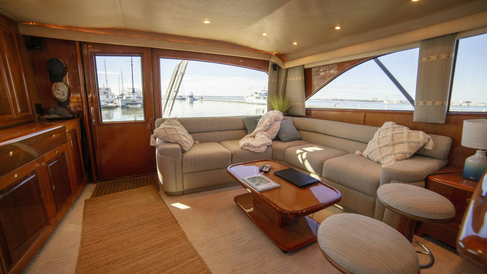 a living room with a couch and coffee table aboard PRIME TIME Yacht for Sale