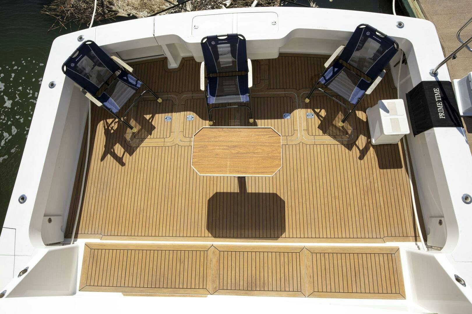 a white and black car aboard PRIME TIME Yacht for Sale