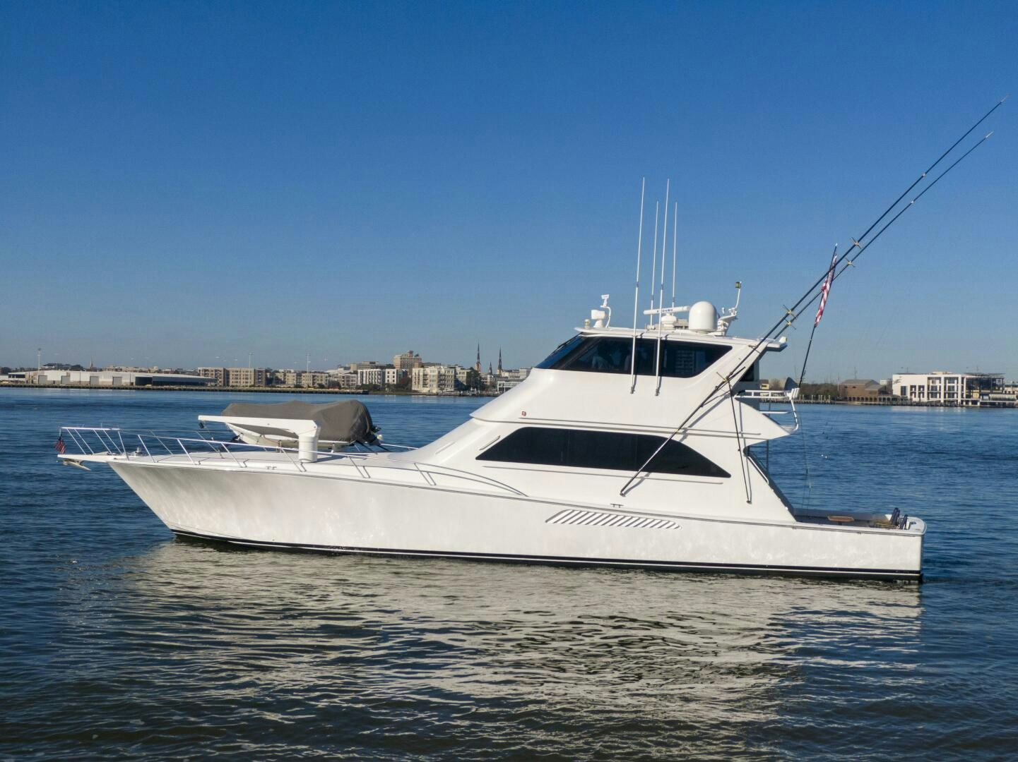 a white boat on the water aboard PRIME TIME Yacht for Sale
