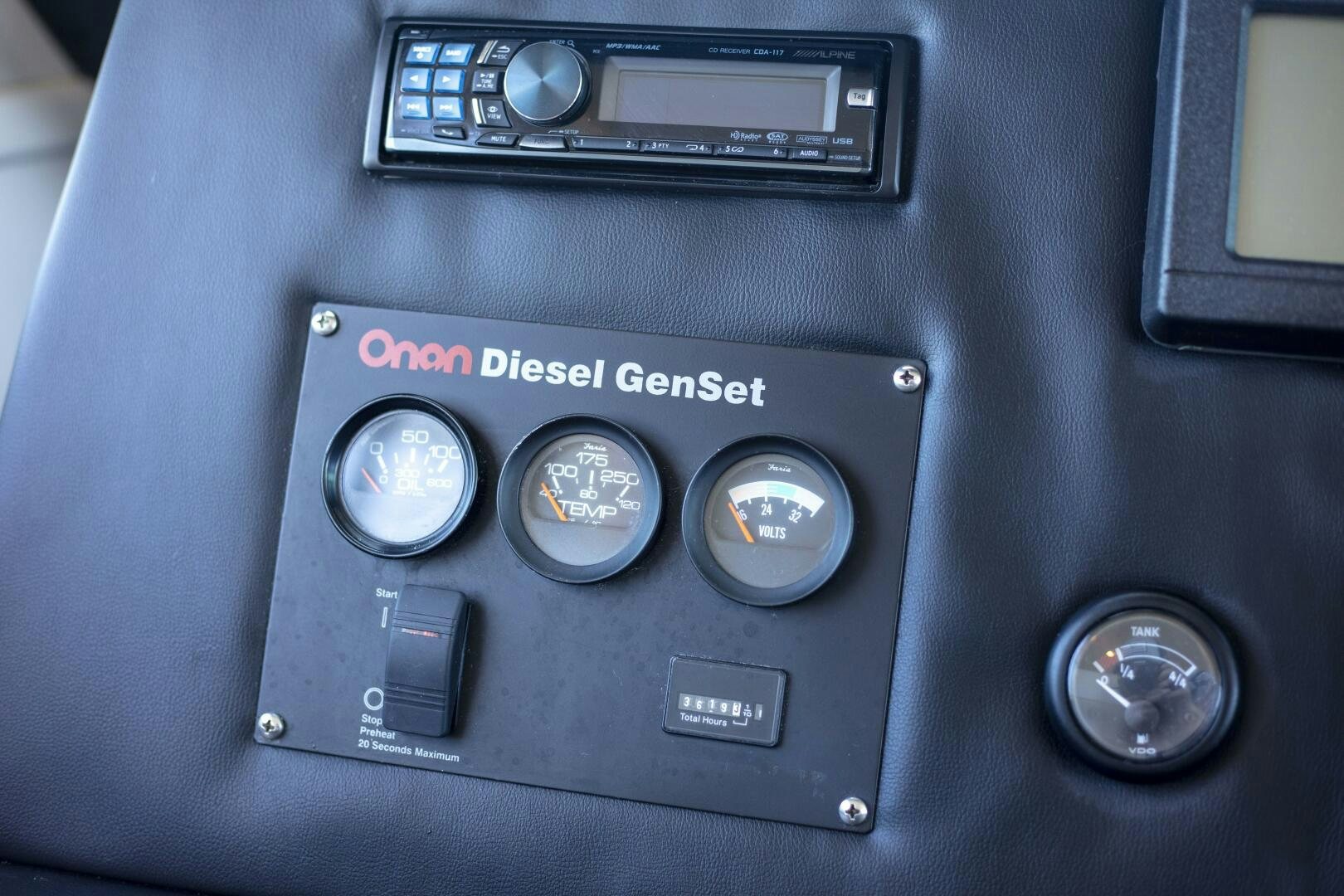 a car dashboard with a screen and buttons aboard PRIME TIME Yacht for Sale
