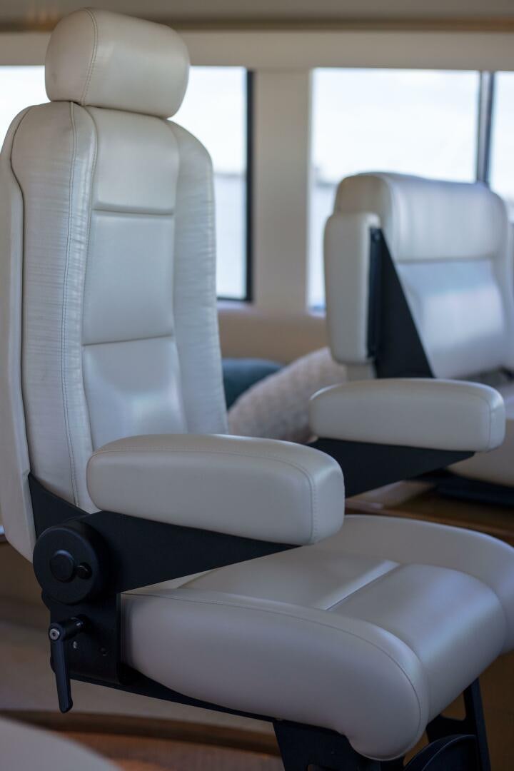 a group of chairs in a room aboard PRIME TIME Yacht for Sale