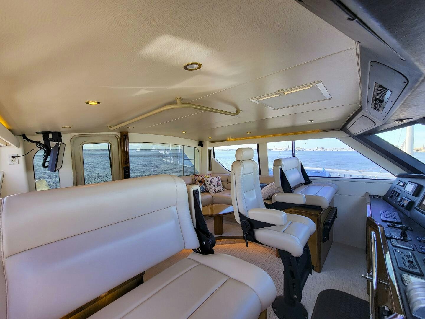 inside of a vehicle with seats and a person sitting in the front seat aboard PRIME TIME Yacht for Sale