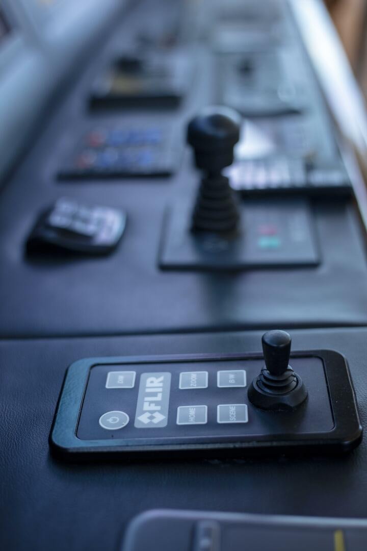 a close-up of a game controller aboard PRIME TIME Yacht for Sale